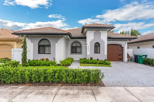 front view of a house with a garden