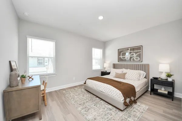 a bedroom with a bed and window