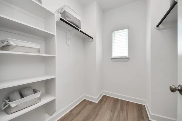 a view of an empty walk in closet