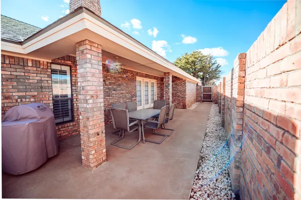 a view of a two chairs in the balcony