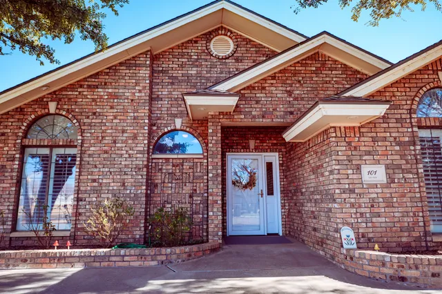 a view of a brick building with entryway