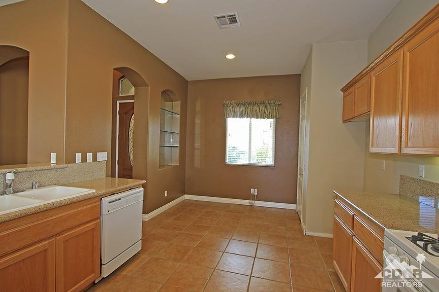 49478 Lewis Road Indio, CA 92201 - Photo 11 of 34 a spacious bathroom with a mirror and a sink