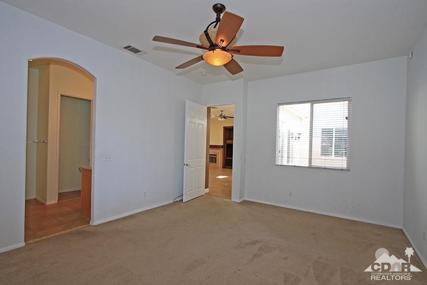 49478 Lewis Road Indio, CA 92201 - Photo 16 of 34 a view of a livingroom with a ceiling fan and window