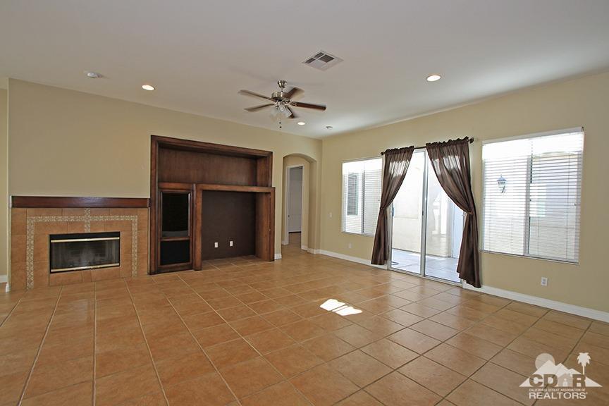 49478 Lewis Road Indio, CA 92201 - Photo 3 of 34 a view of an empty room with a fireplace and a window