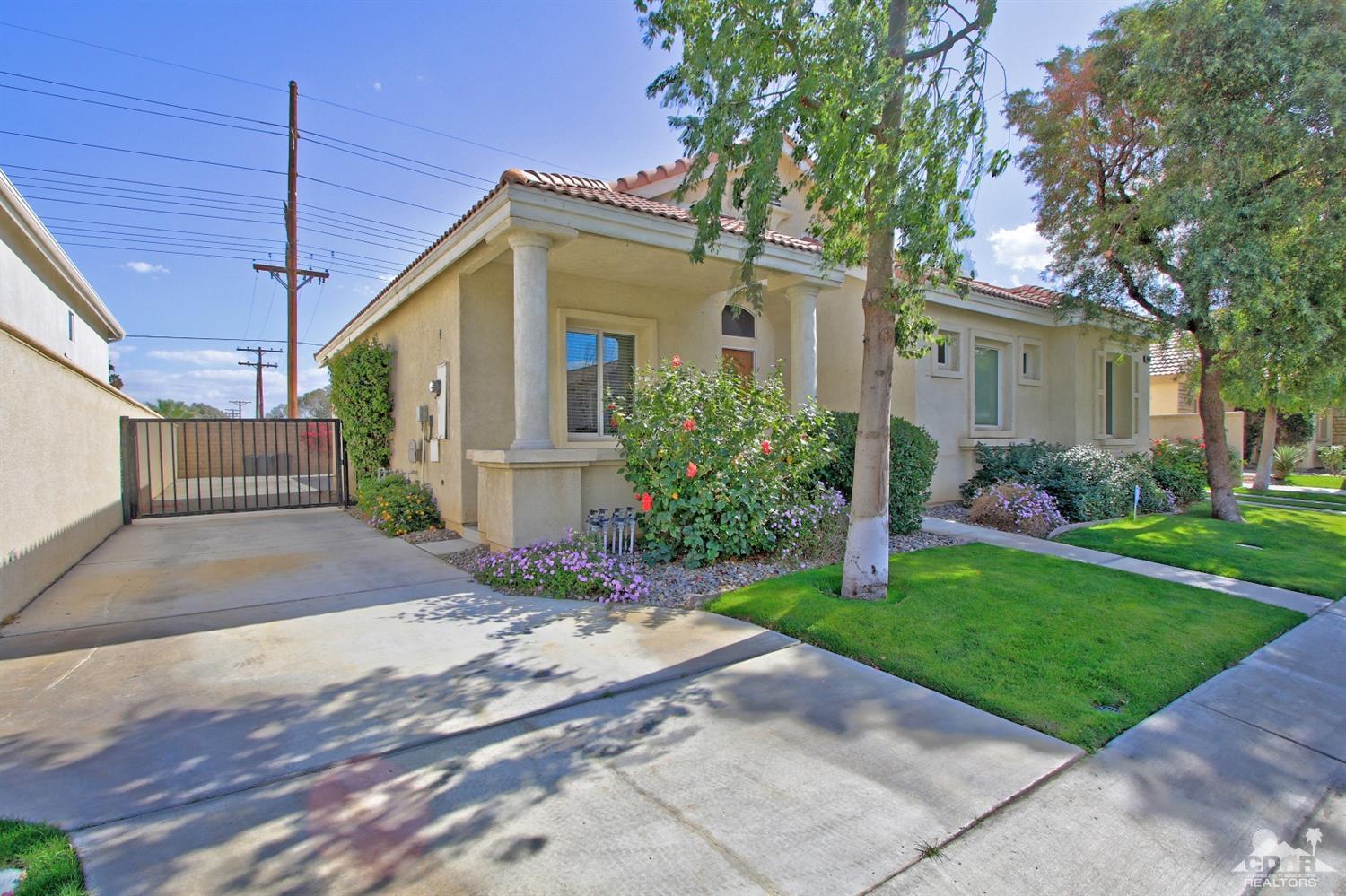 49478 Lewis Road Indio, CA 92201 - Photo 21 of 34 a front view of house with yard and green space