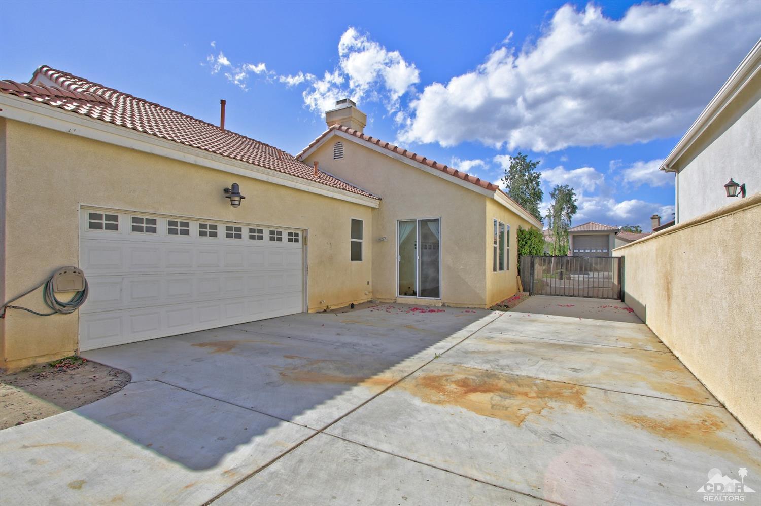 49478 Lewis Road Indio, CA 92201 - Photo 24 of 34 a view of a house with backyard