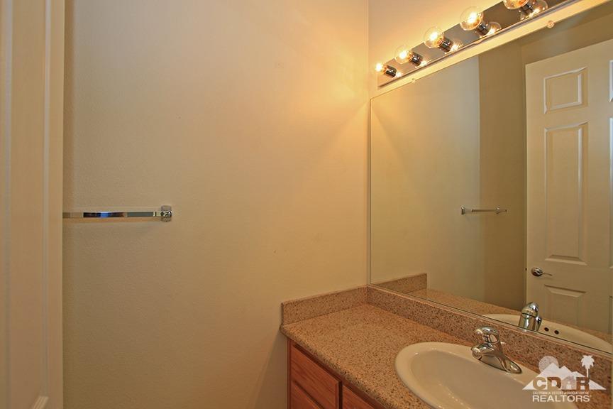 49478 Lewis Road Indio, CA 92201 - Photo 29 of 34 a bathroom with a sink and a mirror