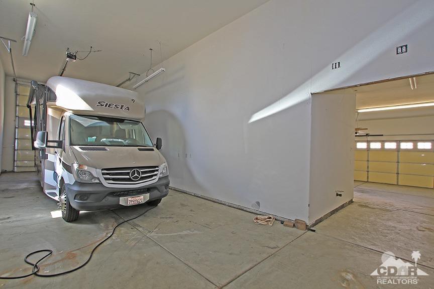 49478 Lewis Road Indio, CA 92201 - Photo 32 of 34 a car parked in a garage