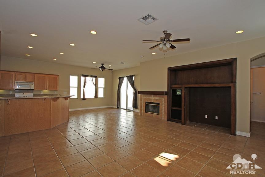 49478 Lewis Road Indio, CA 92201 - Photo 7 of 34 a view of a livingroom with furniture and a ceiling fan