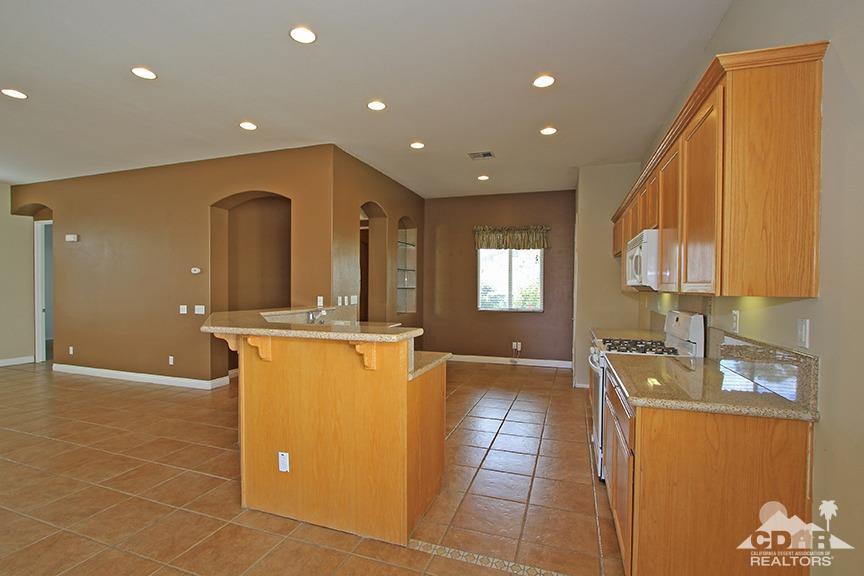49478 Lewis Road Indio, CA 92201 - Photo 10 of 34 a view of a kitchen with granite countertop a sink a counter top space and cabinets