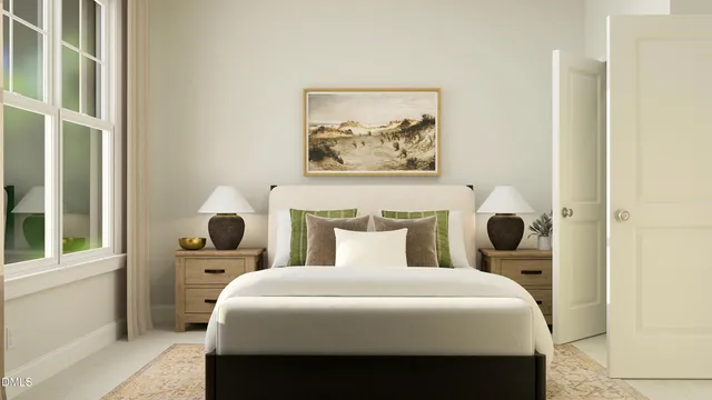 a bedroom with a large bed and a window