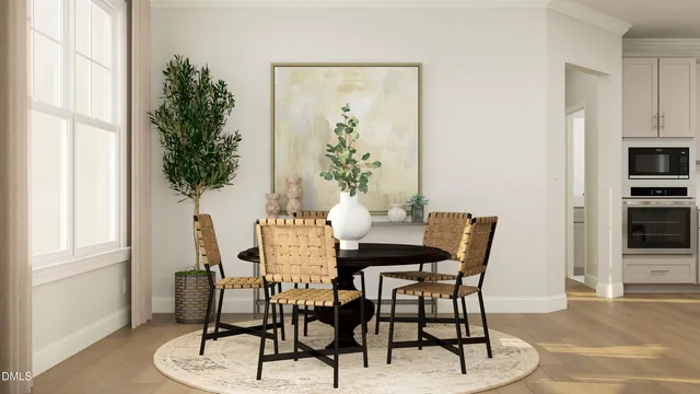 a view of a dining room with furniture and window