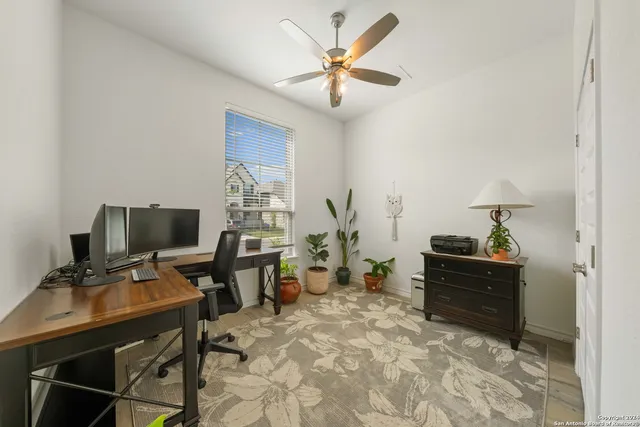 a workspace with furniture and wooden floor
