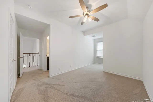 an empty room with fan