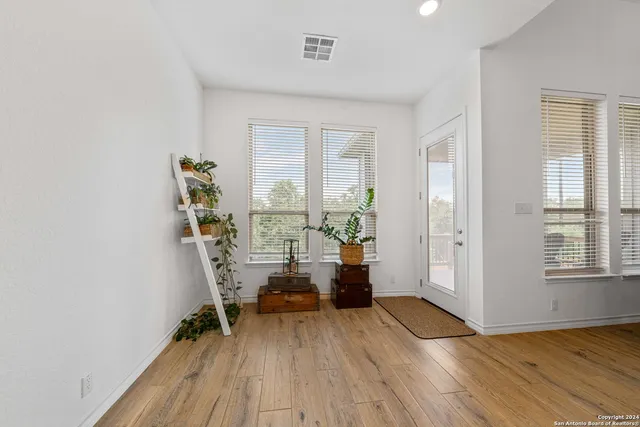a view of a livingroom with furniture and wooden floor
