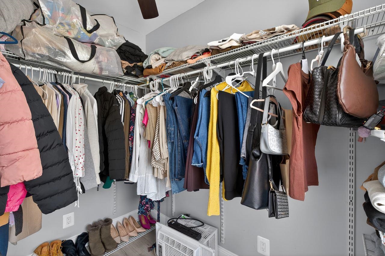 229 Patterson Street Harrison, NJ 07029 - Photo 20 of 26 a view of walk in closet with clothes and shoes