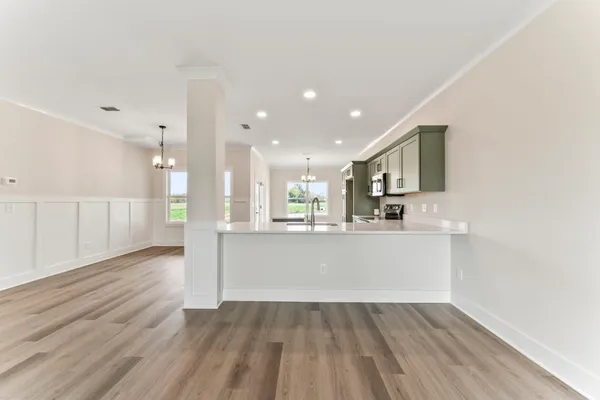 a view of kitchen with wooden floor