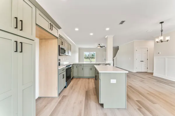 a view of kitchen with wooden floor