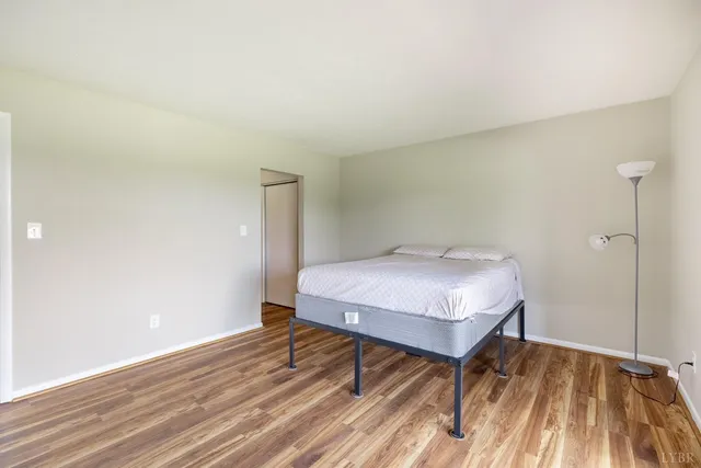 a bedroom with a bed and a table