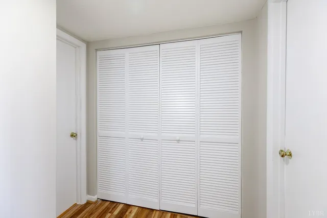 a view of a room with a white door