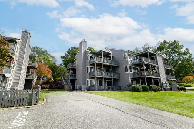a view of a building with a yard