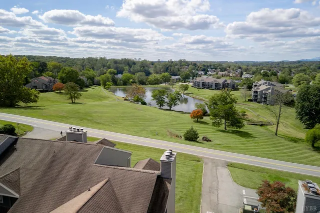 a view of a garden with a building in the background