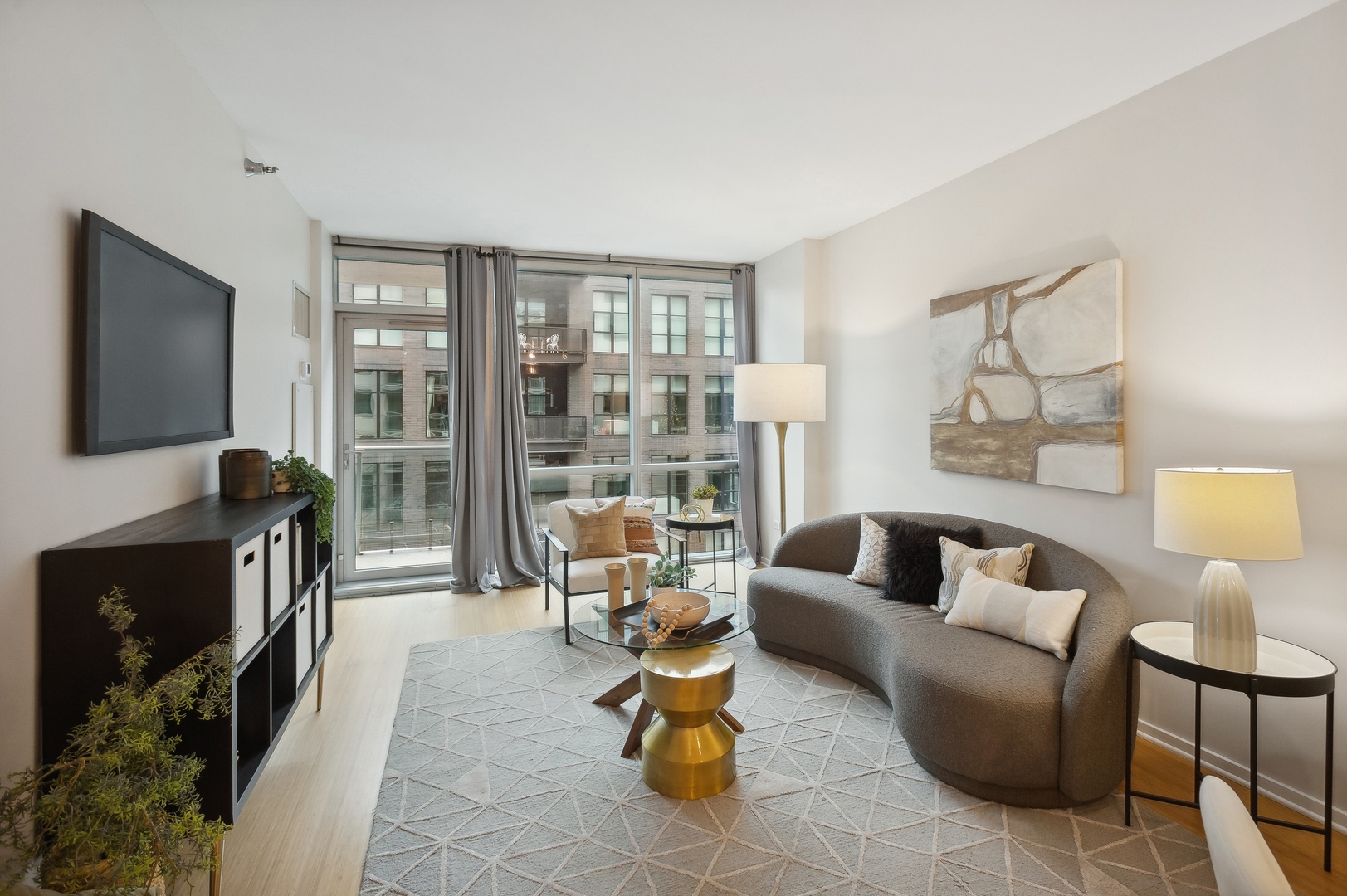 125 South Green Street, Unit 409A Chicago, IL 60607 - Photo 3 of 18 a living room with furniture and a flat screen tv
