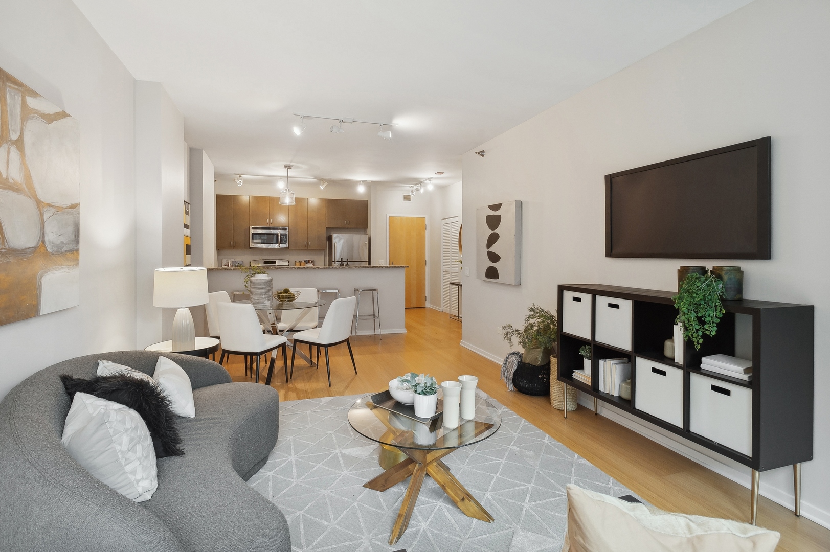 125 South Green Street, Unit 409A Chicago, IL 60607 - Photo 5 of 18 a living room with furniture and a flat screen tv