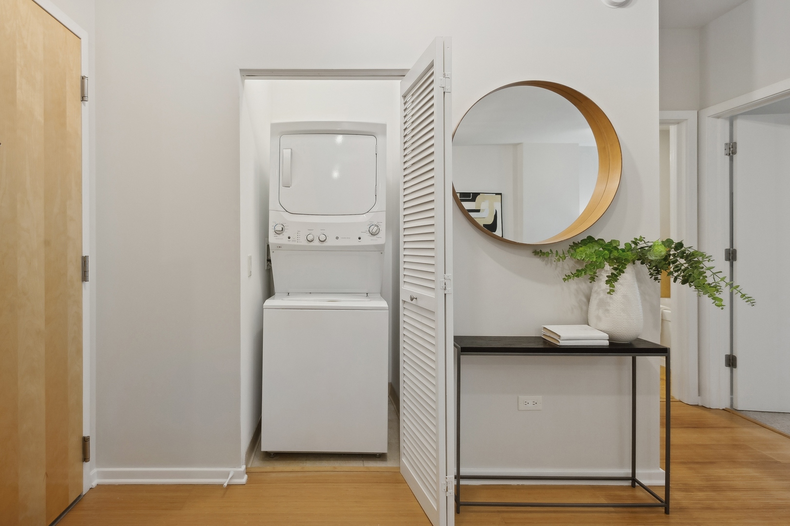 125 South Green Street, Unit 409A Chicago, IL 60607 - Photo 10 of 18 a bathroom with a sink a mirror and a potted plant