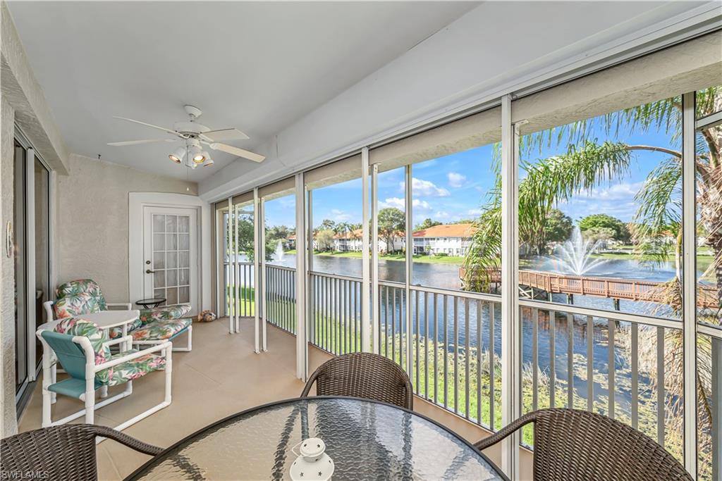 7475 Jacaranda Park Road, Unit 203 Naples, FL 34109 - Photo 3 of 33 XL 22' Screened Lanai w/ Electric Storm Shutters
