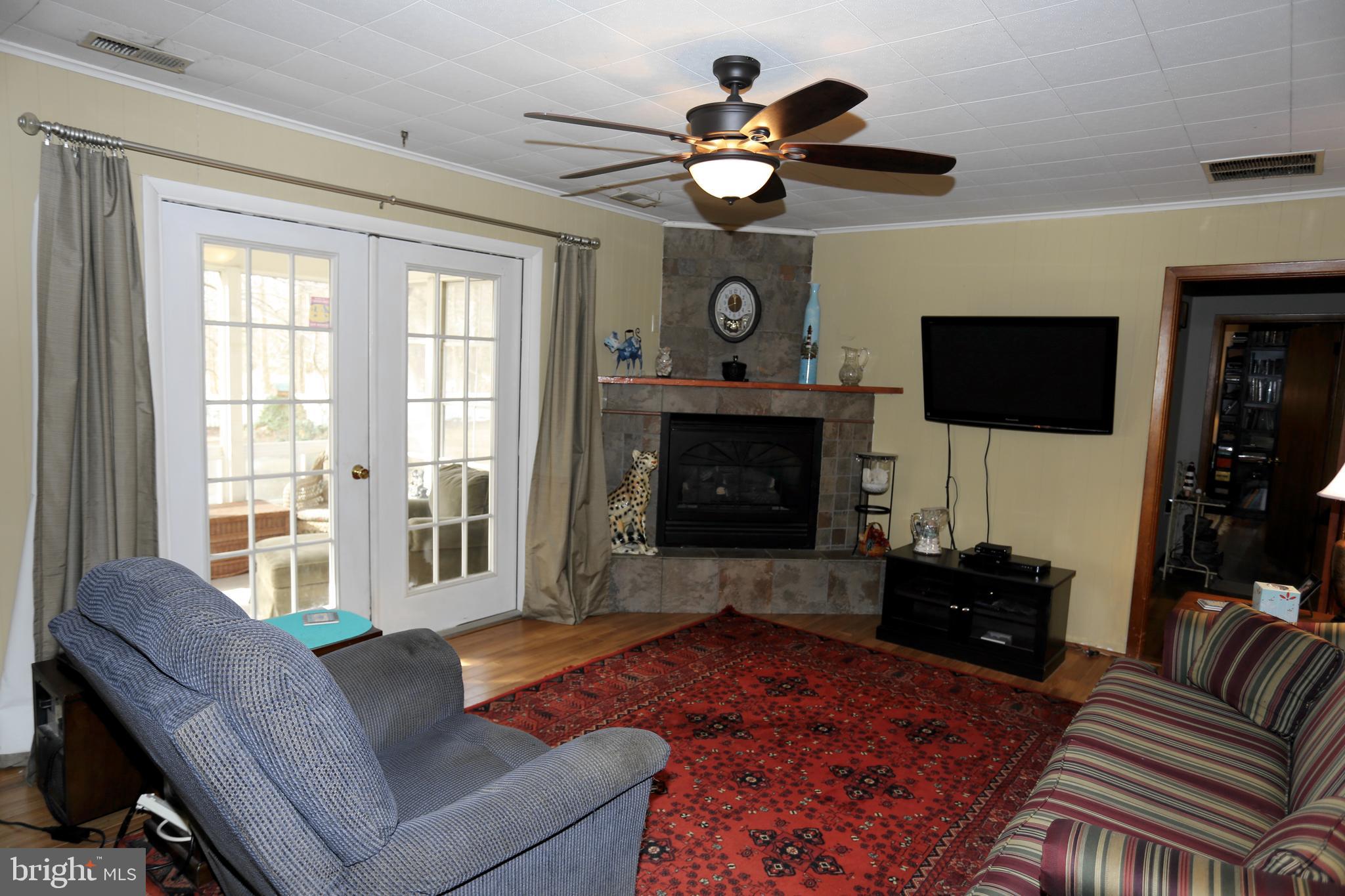 22296 Breasure Road Georgetown, DE 19947 - Photo 4 of 47 Family room with sliders leading to sun room