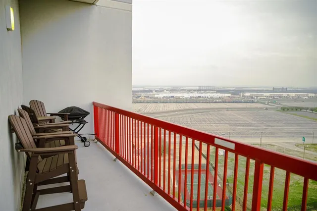 a balcony with an outdoor seating
