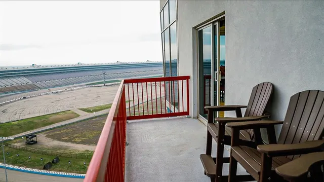 a view of a balcony with furniture