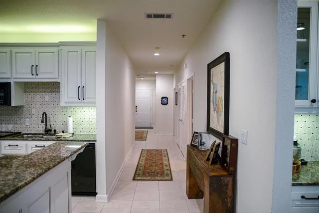 a kitchen with a sink and a refrigerator