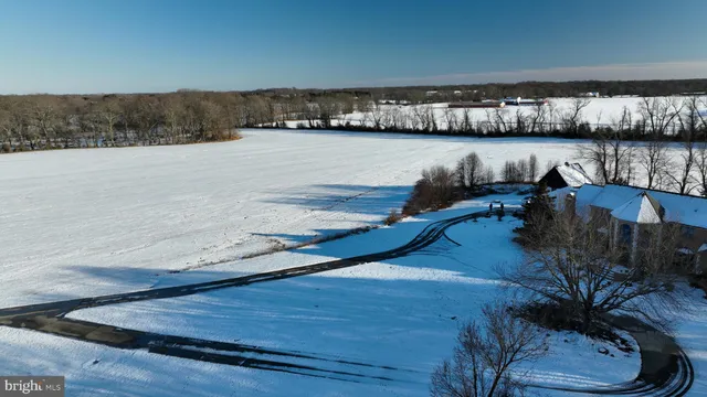 a view of a swimming pool and an outdoor seating