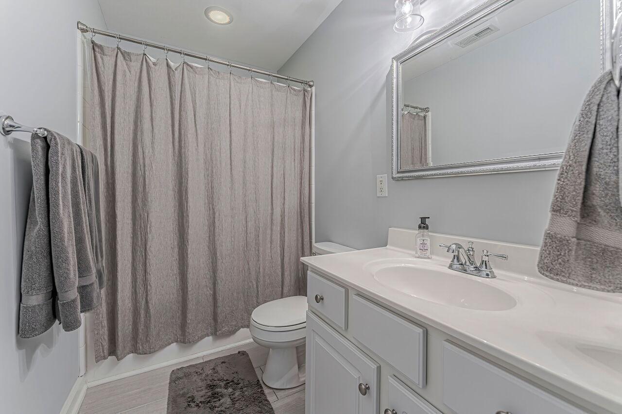 106 Hatfield Lane Raleigh, NC 27603 - Photo 18 of 29 a bathroom with a sink a toilet and shower