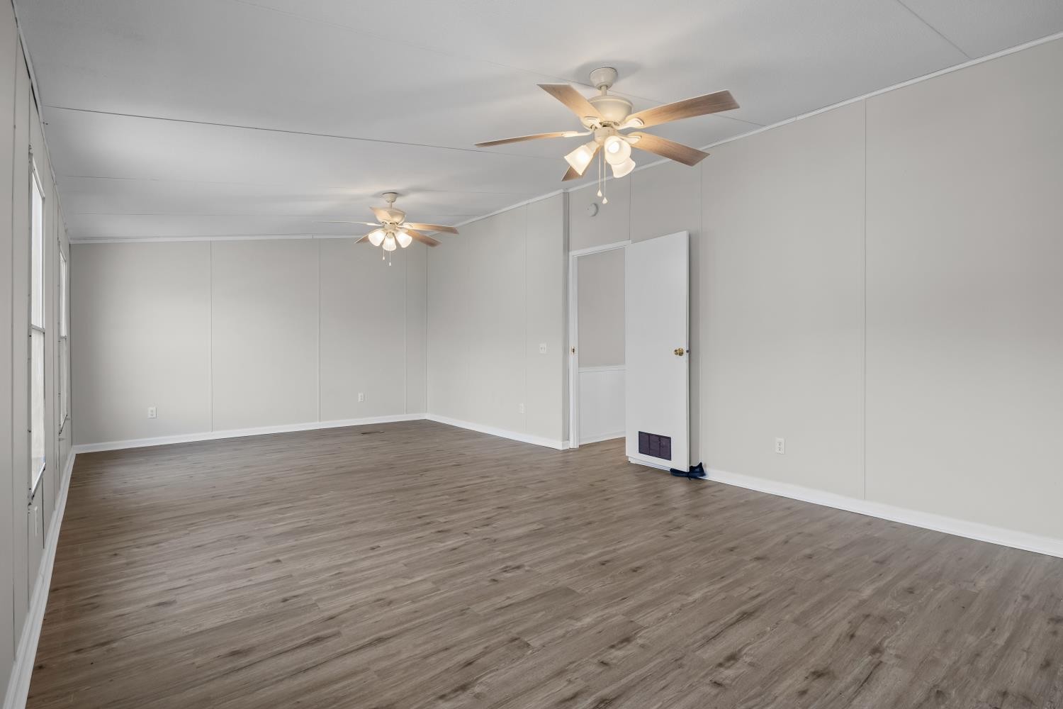 624 Nickletown Road Sugar Tree, TN 38380 - Photo 24 of 45 a view of an empty room with wooden floor