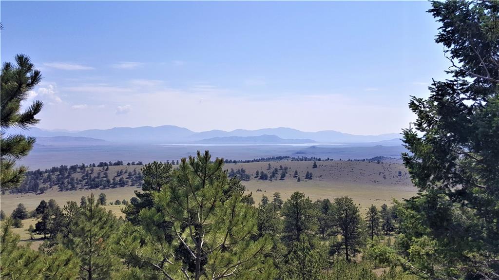 Lot 5879 Running Bear Road Hartsel, CO 80449 - Photo 4 of 34 a view of lake with mountain in the back