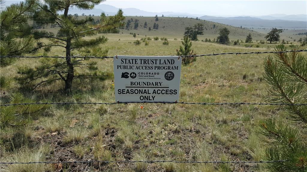 Lot 5879 Running Bear Road Hartsel, CO 80449 - Photo 9 of 34 a view of a sign with a park