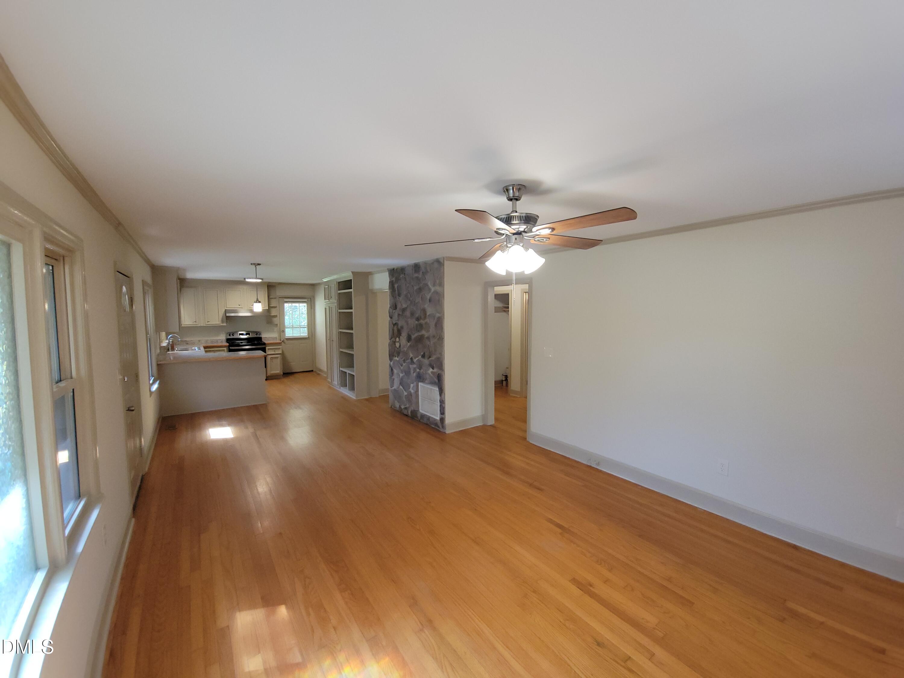 7000 Holly Springs Road Raleigh, NC 27606 - Photo 6 of 24 a view of livingroom with furniture and chandelier fan