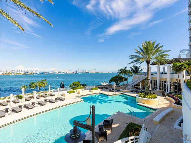 a view of swimming pool with outdoor seating