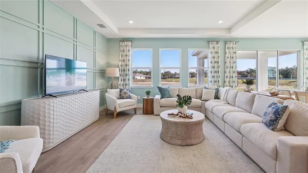 a living room with furniture and a large window