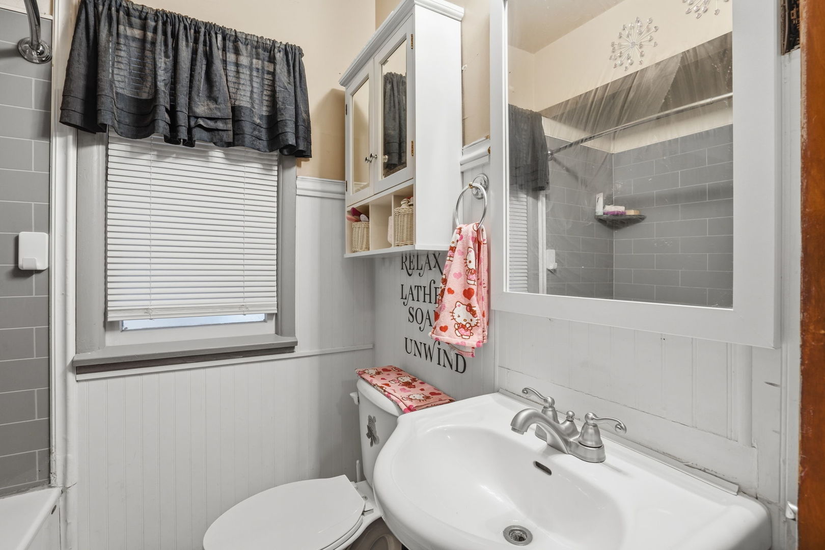 2730 4th Street Moline, IL 61265 - Photo 14 of 25 a bathroom with a sink and mirror with toilet