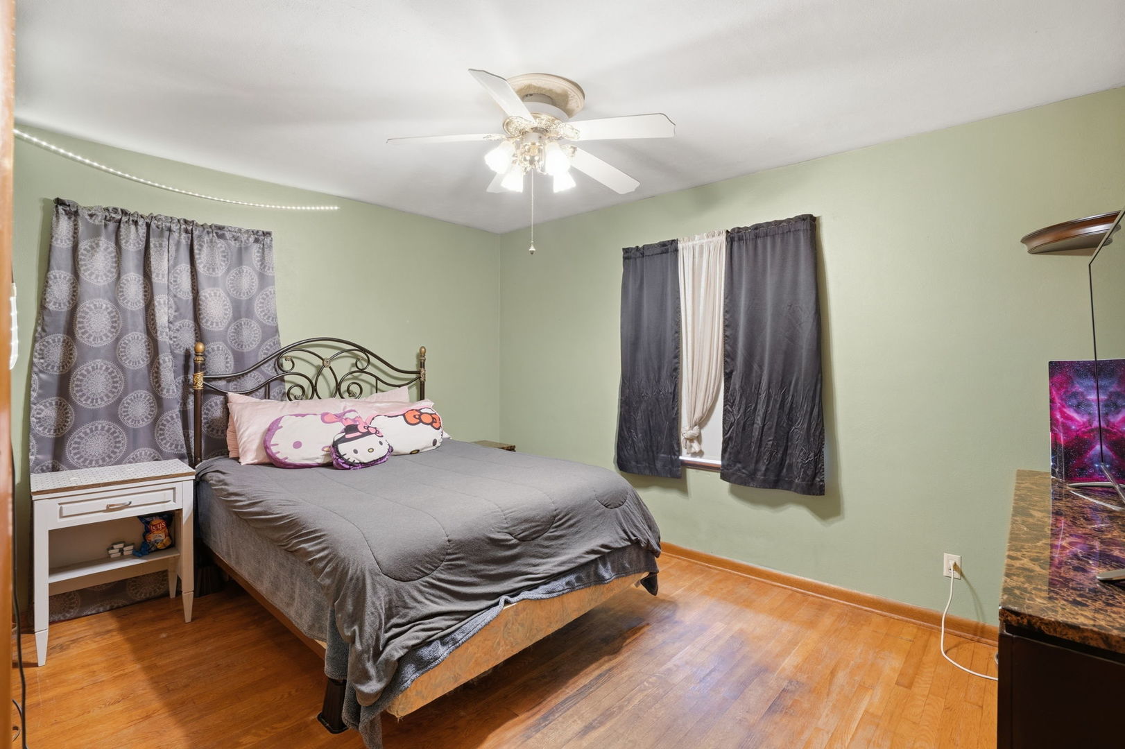 2730 4th Street Moline, IL 61265 - Photo 17 of 25 a bedroom with a bed and a chandelier