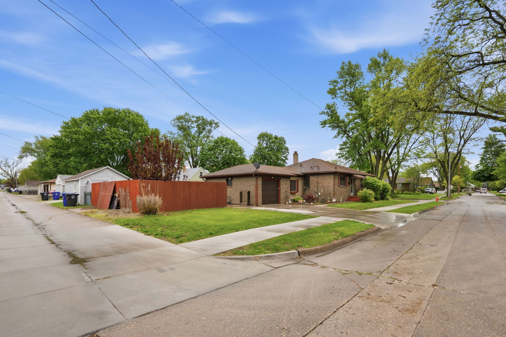 2730 4th Street Moline, IL 61265 - Photo 2 of 25 a view of a house with a yard and street