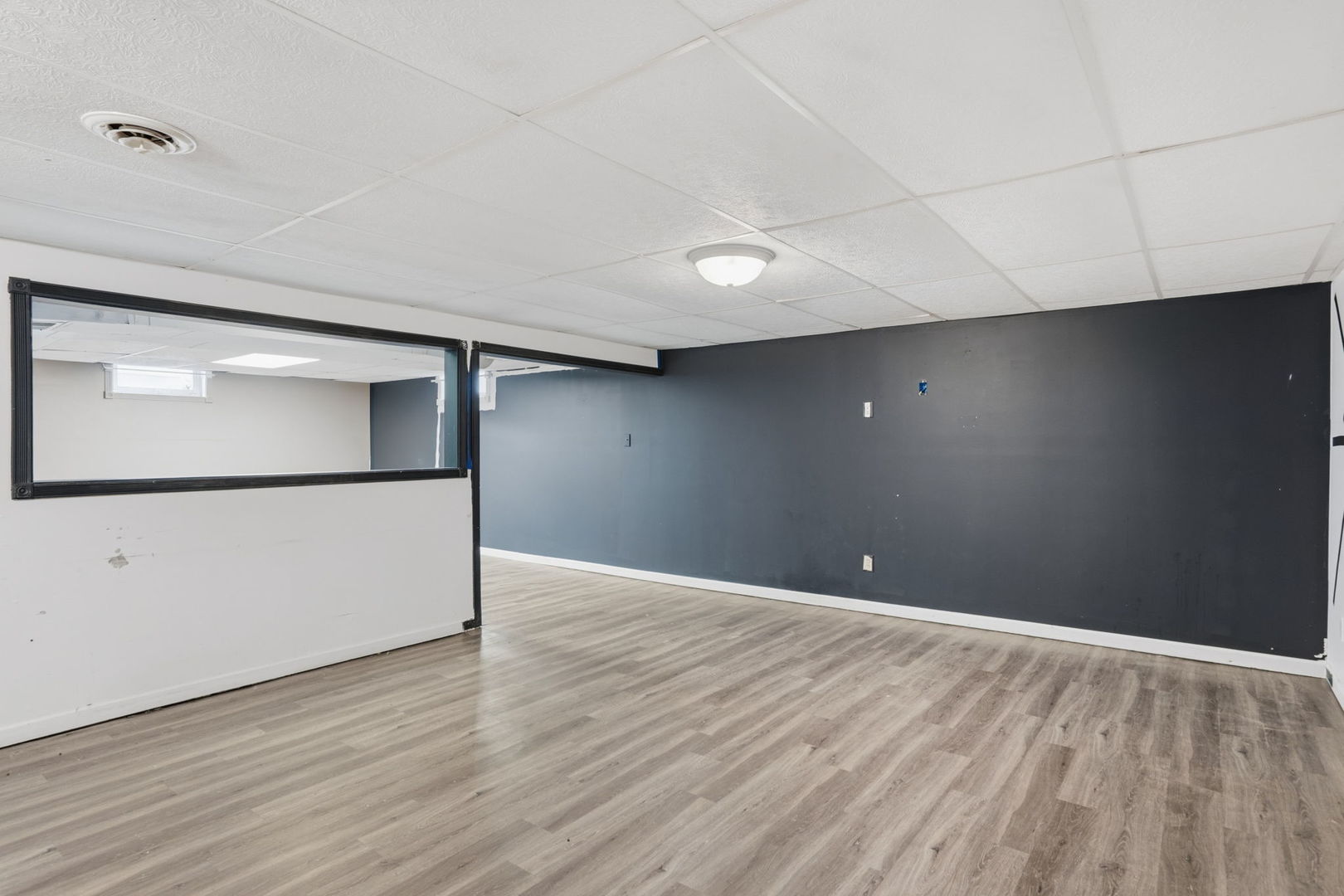 2730 4th Street Moline, IL 61265 - Photo 21 of 25 a view of an empty room with wooden floor