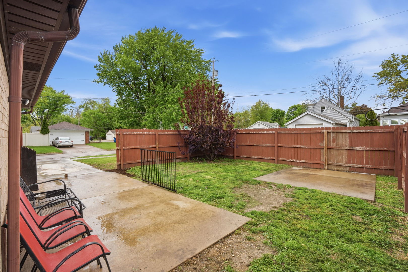 2730 4th Street Moline, IL 61265 - Photo 4 of 25 a view of a backyard with wooden fence