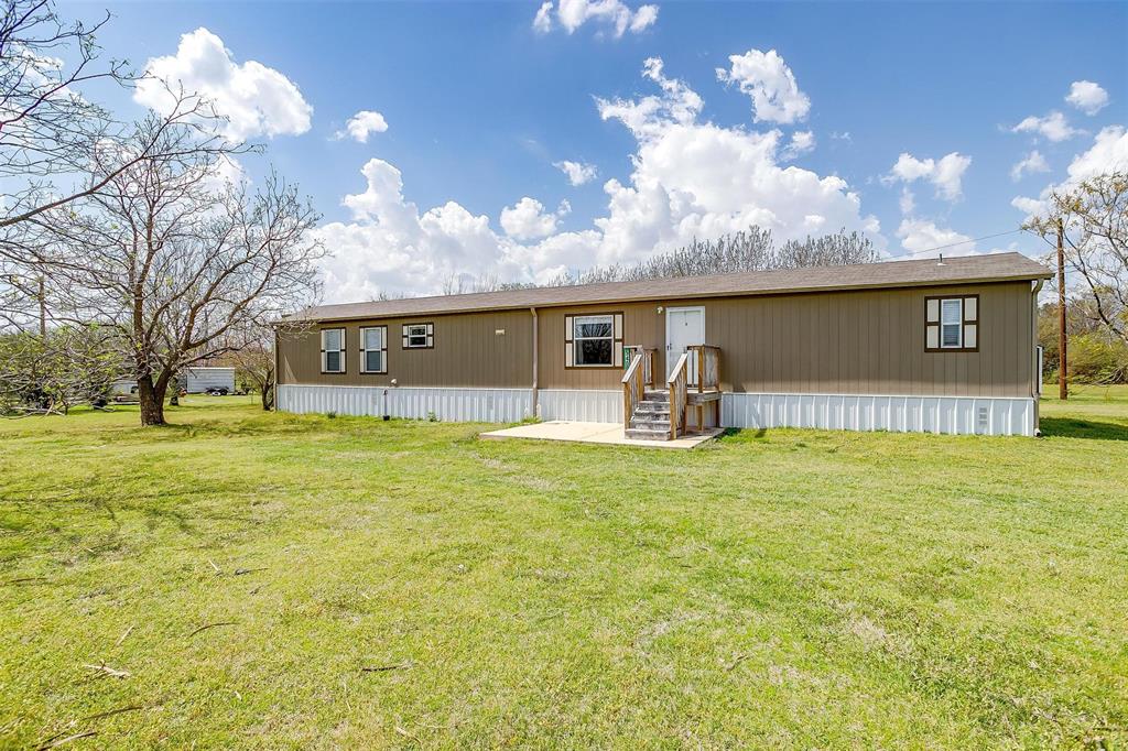 View of front of property with a front yard