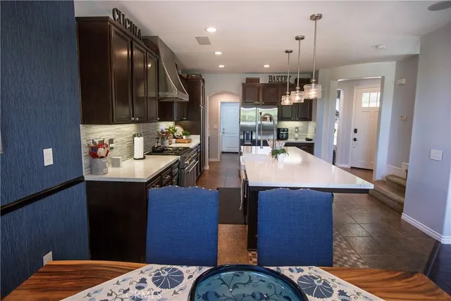 a kitchen with a sink appliances and cabinets