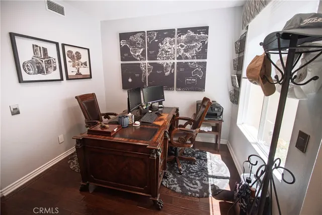 a work room with furniture and a window